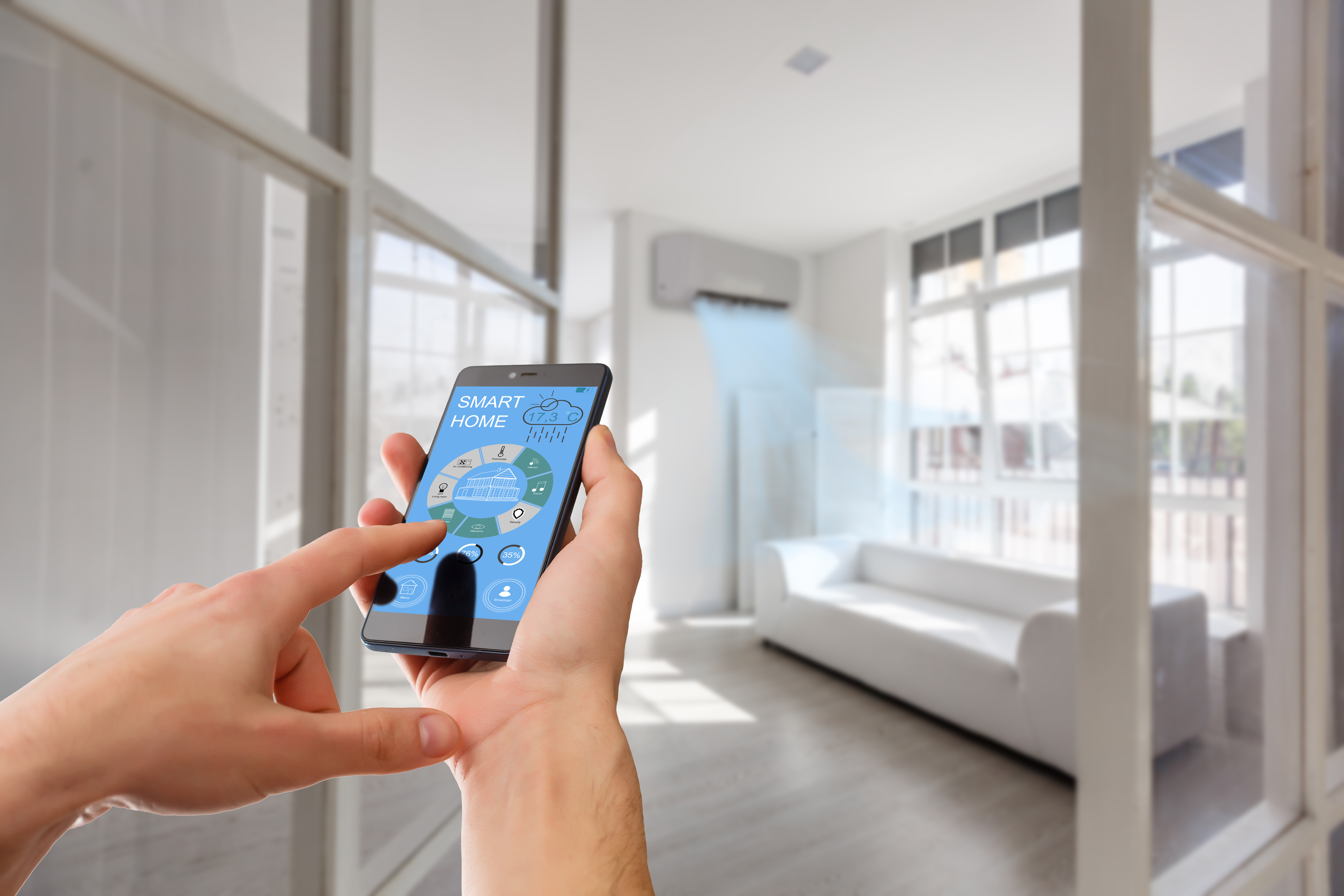 Inside a modern living room, a person holds a smartphone to use an app titled "Smart Home."