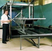 Operator controlling 1/6 scale prototype of bridge construction
