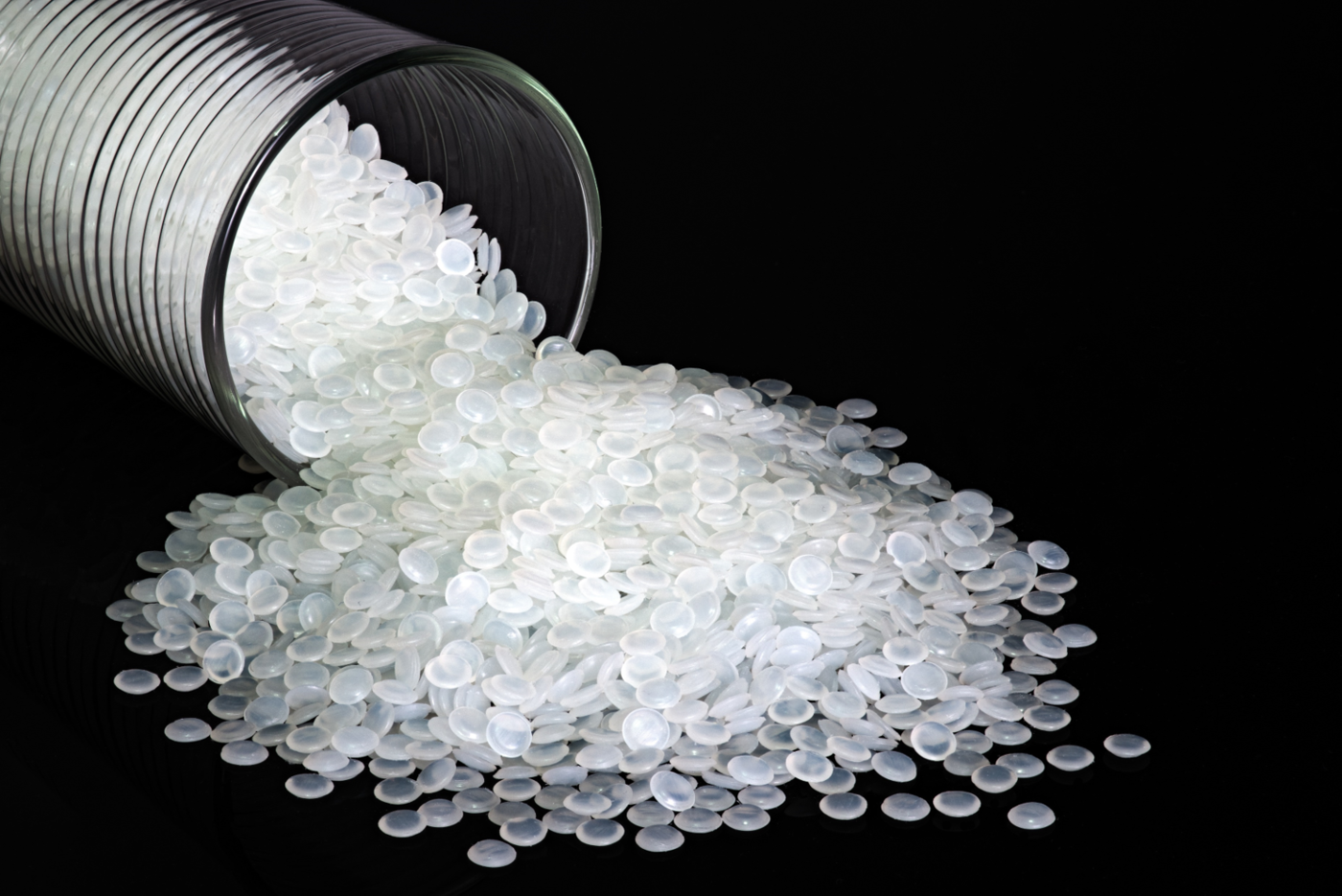 a vial of white polymer beads for industry/research