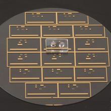 Close up photograph of the NIST micro microwave oven showing its two major components