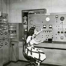 Woman uses gas analysis mass spectrometer at NBS for chemical analysis of gas or vapor mixtures