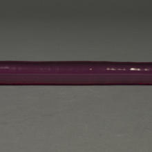 A purple crystal cylinder, pointed at the ends