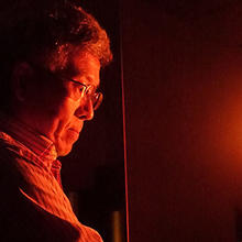 Howard Yoon with the NIST standard of spectral irradiance, a bright light, well-calibrated light bulb..