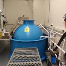 Blue metal spherical tank surrounded by pipes