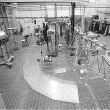 Large rooms with scattered pieces of scientific equipment