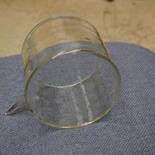 A short glass cylinder