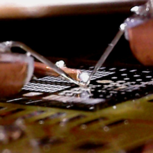 Custom-built wafer level probes in position to perform EDMR measurements on fully processed transistors. 
