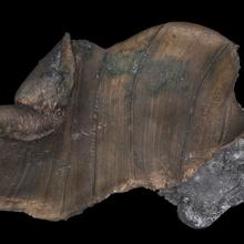 Digital image shows twisted metal fragment.