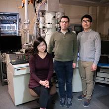 Three NIST scientist in front of transmission electron microscope