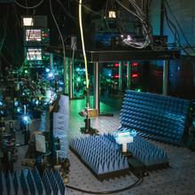 Scientific equipment in a darkened lab.