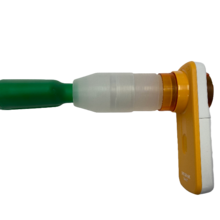 Cannabis breathalyzer device has a yellow plastic handle and green plastic mouthpiece. 