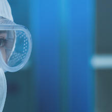 banner image of cleanroom workers in full protective gear