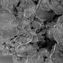 Black and white enlarged image of moon dust particle