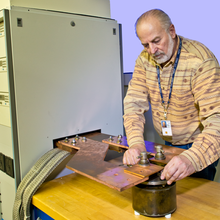 Marlin Kraft adjusts a current shunt connection.