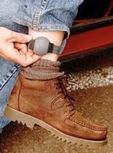 Tracker on the ankle of a man.