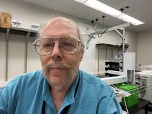 man with mustache and glasses