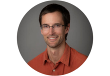 Benjamin Caplins, person with short brown hair and glasses