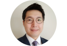 professional headshot of Yoontae Kim, a person with short black hair and glasses, wearing a suit