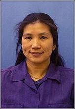 Li Piin Sung, a person with long black hair, smiles for the camera.