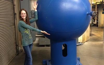 NIST researcher Jodie Pope with the big blue ball