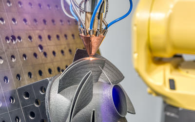 a 3D metal printer produces a complex steel part