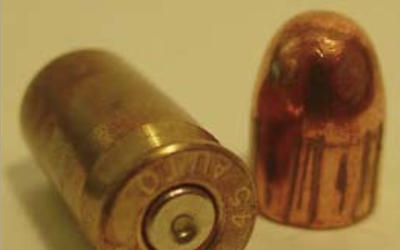 A fired cartridge case and a fired bullet.