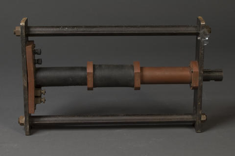 Reference specimen holder used to magnetically compare prison bars, circa 1930s. The holder is metal.