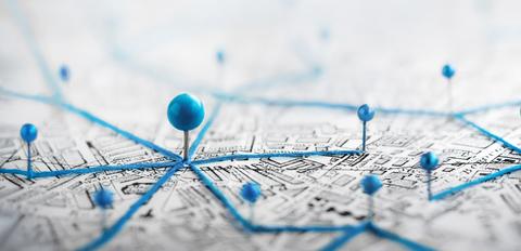 push pins and routes on a map