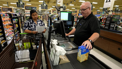 OWM’s John McGuire demonstrating Universal Product Code (UPC) barcode scanning for price verification 