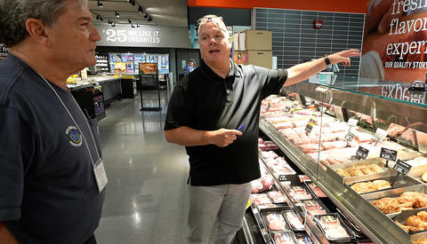 OWM’s John McGuire instructs a Massachusetts Weights and Measures Official Dennis Clark – Westfield MA on how to properly conduct a price verification at the typical grocery store meat counter.