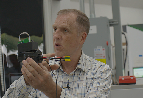 Photo of Ted Bohn with EVSE equipment
