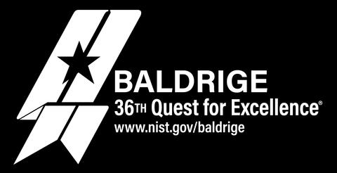 The 36th Baldrige Quest for Excellence reversed white logo on dark background..