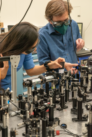 Researchers are working to optimize beam alignment while developing a nonlinear laser experimental setup. 