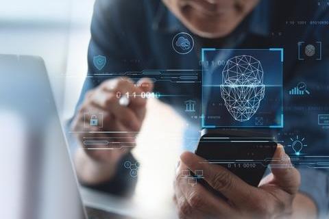 Person holding face map and phone