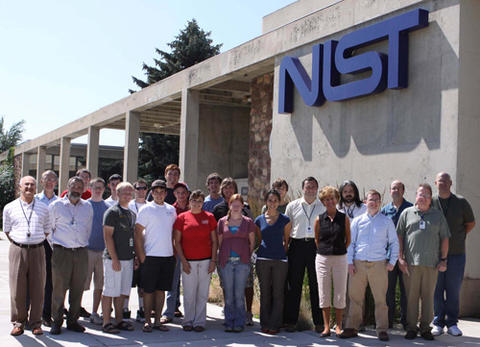a collection of TRC staff gathered in front of the NIST Radio Building in Boulder