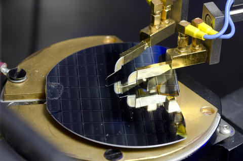 A graphene-insulator-semiconductor sample under electrical test.