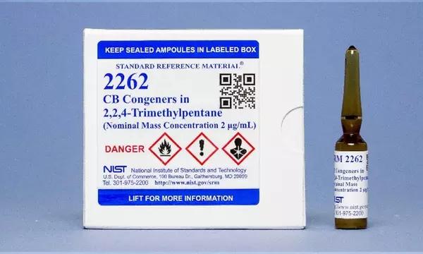Photograph of a unit of SRM 2262 consisting of a labeled box and a labeled amber vial.
