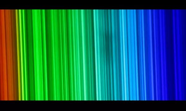 Vertical lines of light change from red to green to blue going left to right.