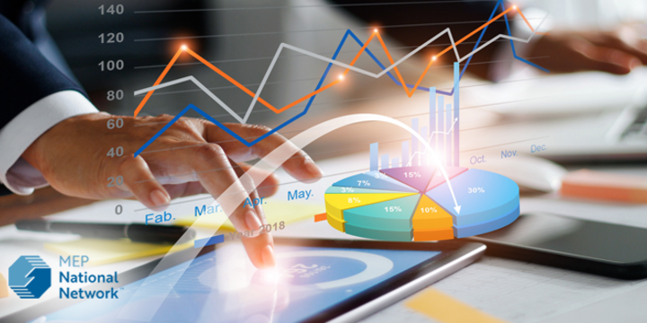 Businessman using tablet and laptop analyzing sales data and economic growth graph chart.