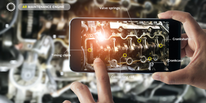 Augmented reality concept. AR. Industrial 4.0 , Hand of engineer holding mobile smart phone using virtual AR to check the work of electric machine on smart factory background