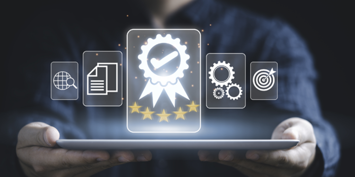 Businessman holding tablet and showing the best quality assurance with golden five stars 