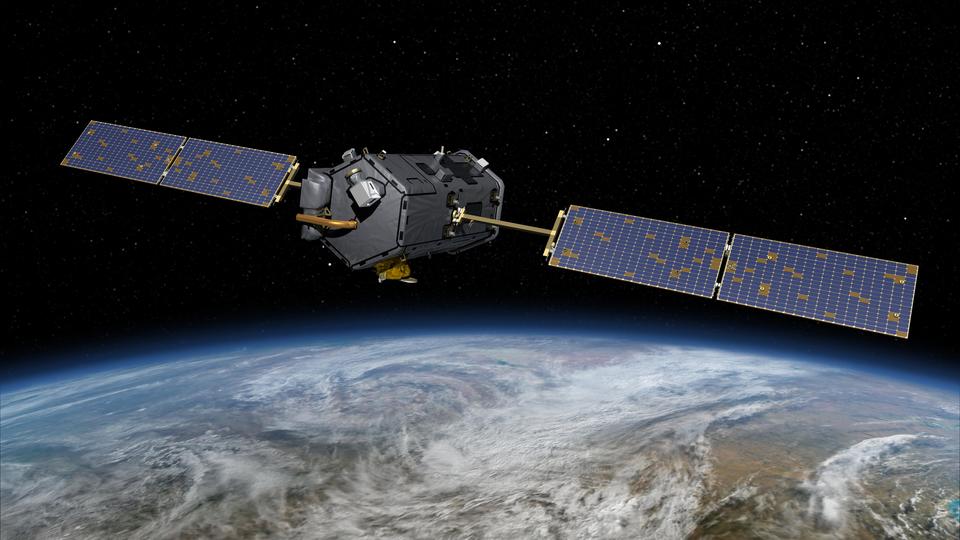 Illustration shows a satellite with solar panels off to each side floating in space above the Earth. 