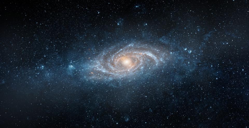 A spiral galaxy drifts in a dark sea of space. 