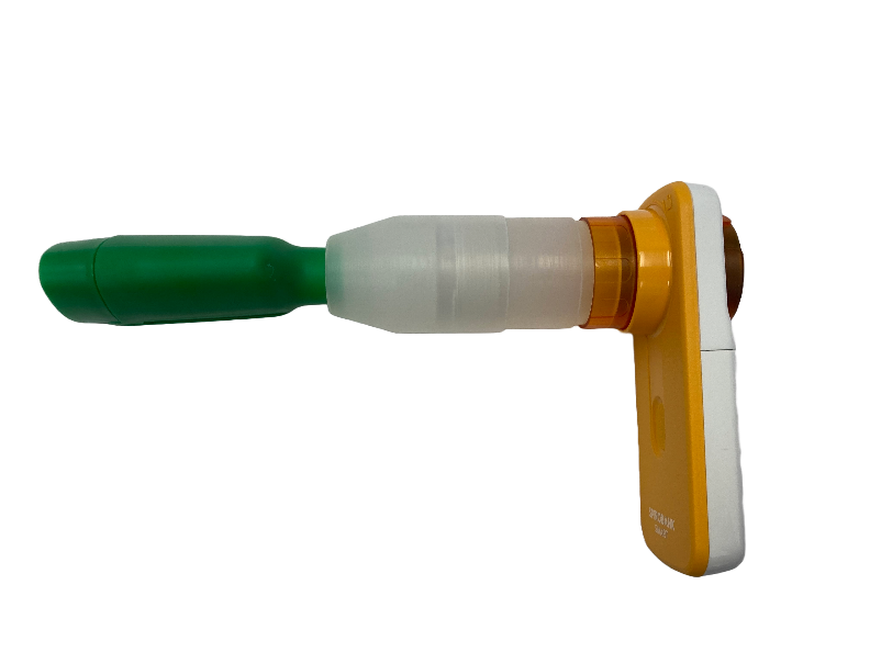Cannabis breathalyzer device has a yellow plastic handle and green plastic mouthpiece. 