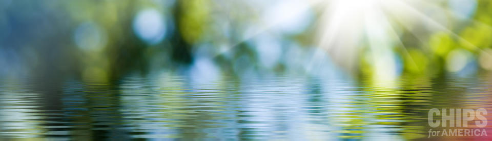 banner image showing still water with slow ripples across it on a beautiful sunny day