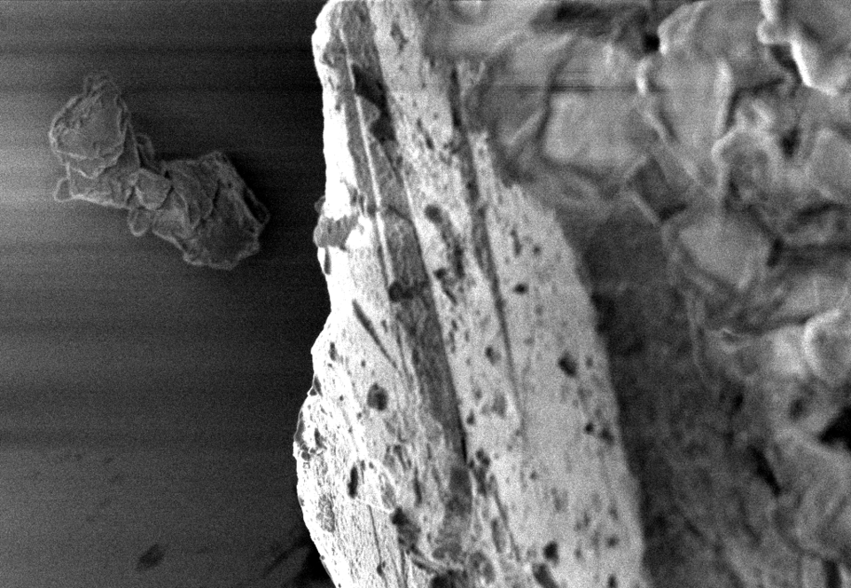 Black and white enlarged image of moon dust particle