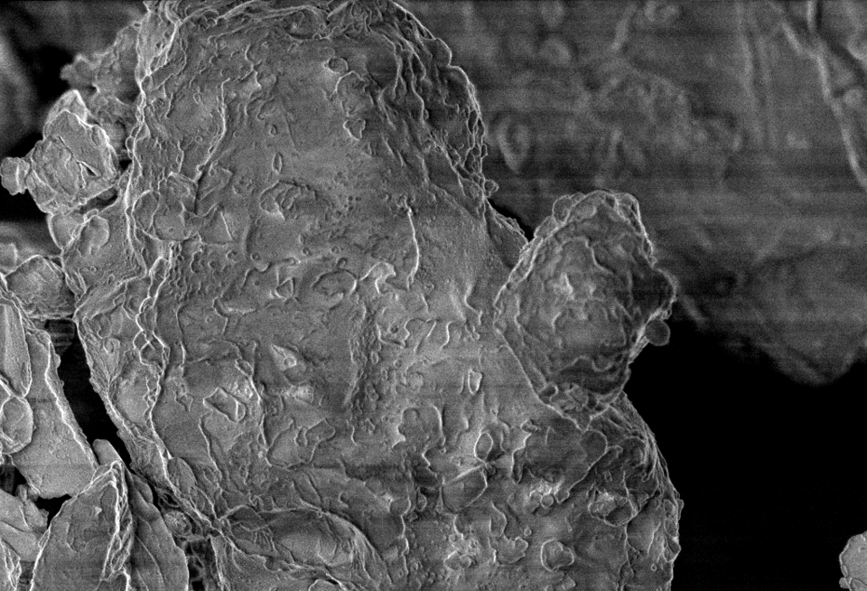 Black and white enlarged image of moon dust particle