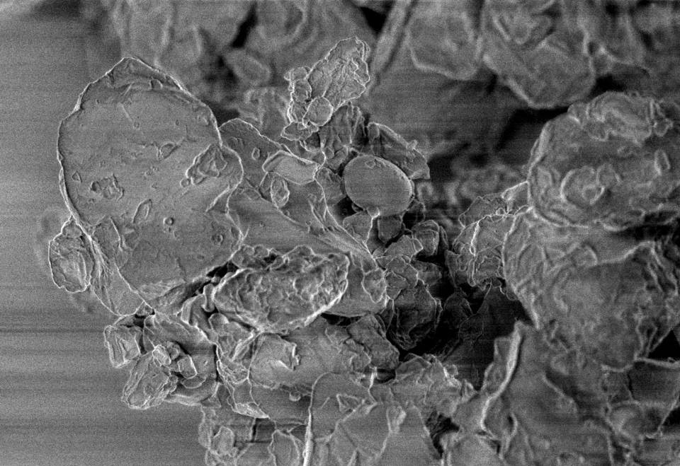 Black and white enlarged image of moon dust particle