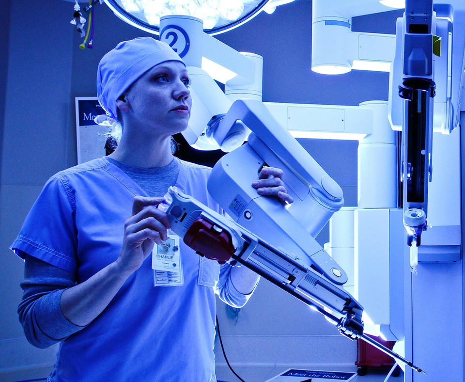 St. David’s HealthCare photo of employee using equipment in a hospital.