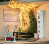 A Christmas tree is engulfed in flames. To the left is a chair. In front is a coffee table, rug and fishbowl. To the right is a tall bookshelf. There are 3 wrapped presents under the tree. A timer reads 8:04 seconds.